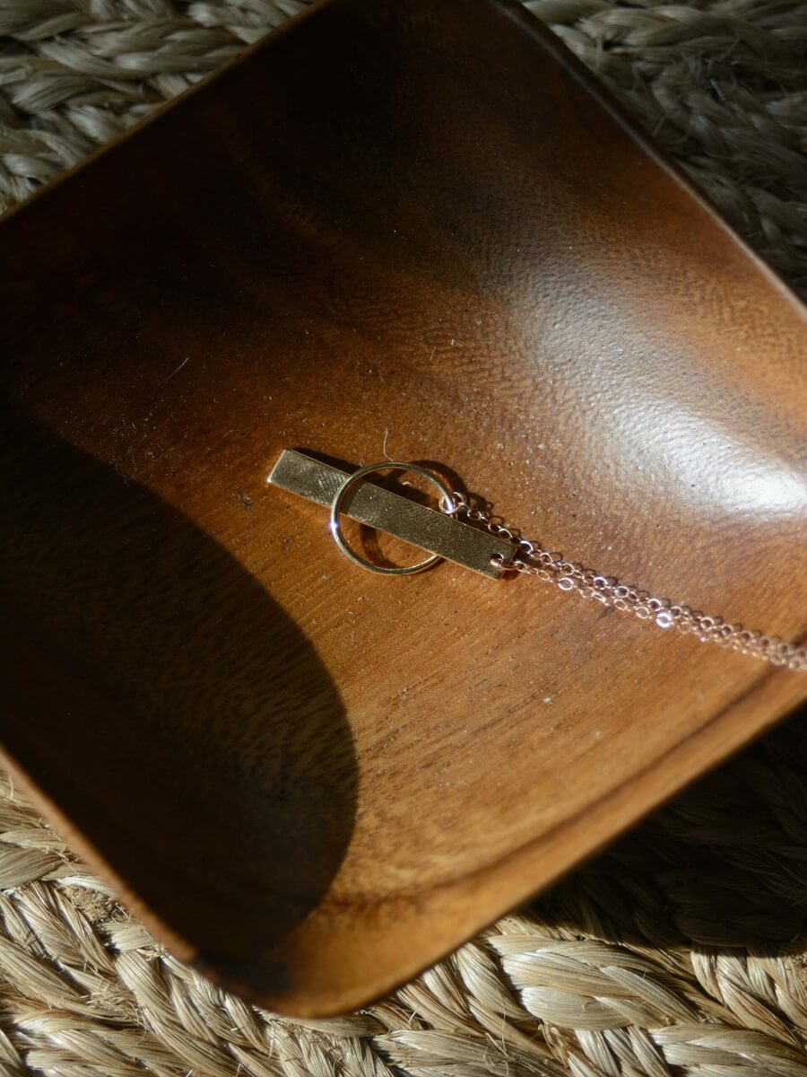 Close-up of a Gucci Horsebit 1955 bag, brown leather with gold hardware.